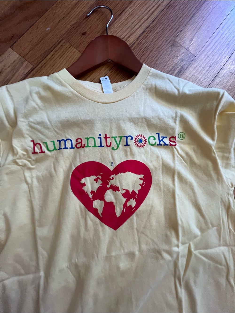 Next Level Apparel Yellow Tee with Multicolor "humanityrocks" Graphic - Medium